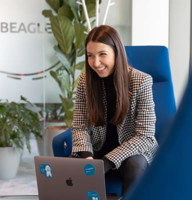 Woman laughing during work